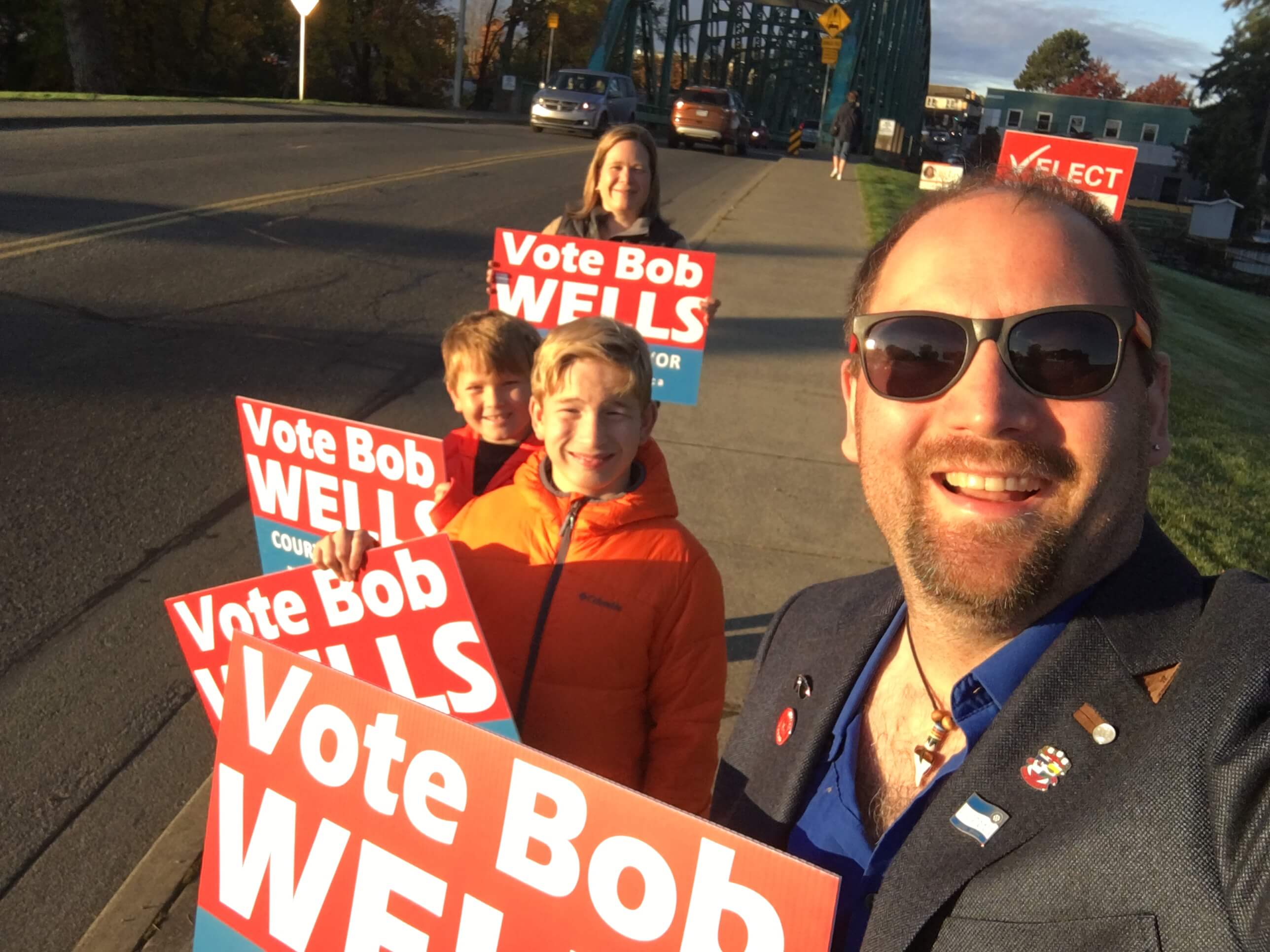 Bob Wells and Family with signs